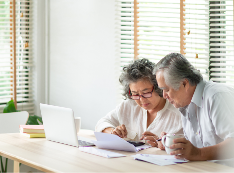 Couple calculating cost for budgeting and financial planning