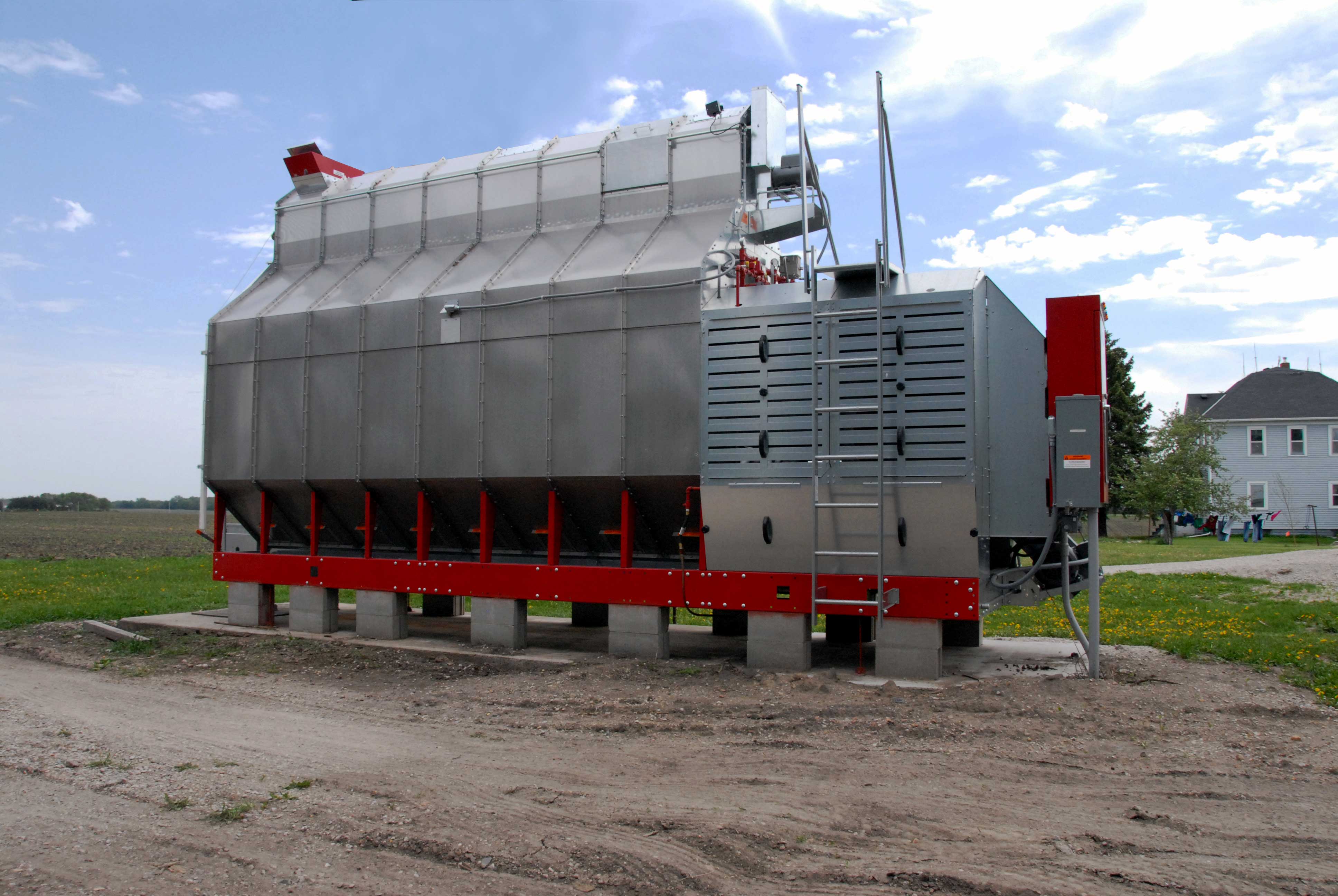 A horizontal continuous cross-flow grain dryer with no heat recovery