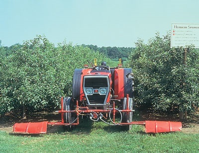 Mount shields to protect nozzles from wind and prevent drift — an added benefit is protecting low branches from herbicide.