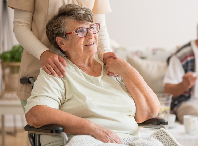 Senior sitting in wheelchair in nursing home