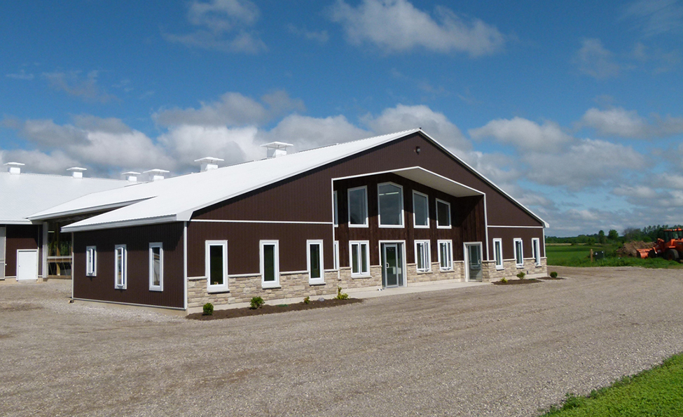 Front view of a dairy barn showing the milking centre