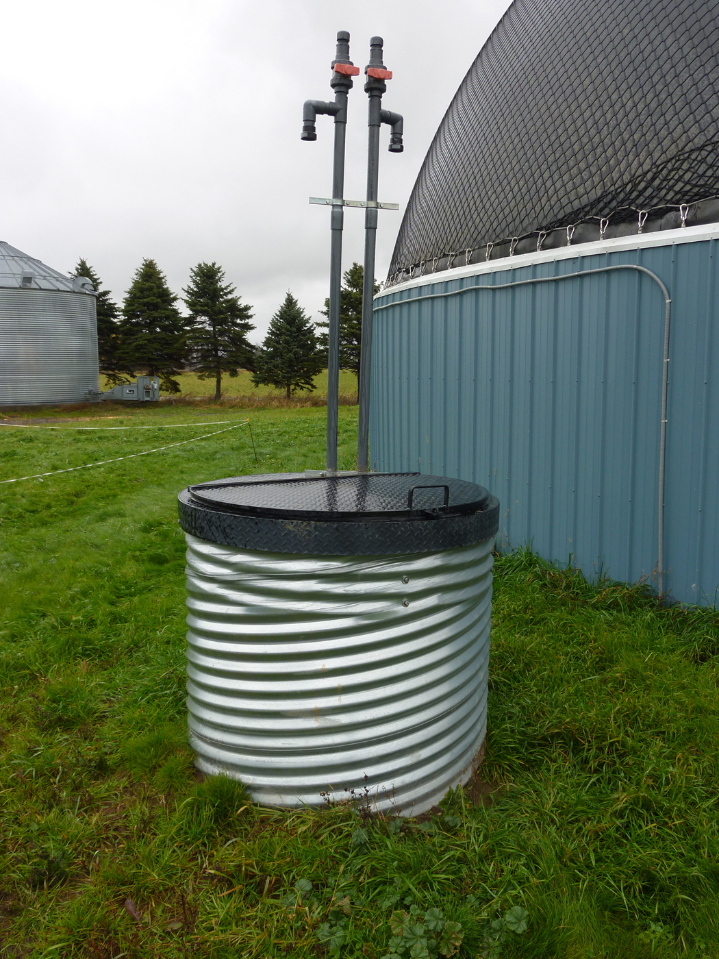 The access point to the condensation well where the moisture removed from the biogas is collected.