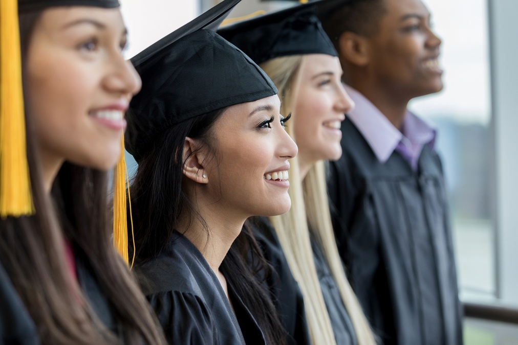 People standing in a row during a graduation