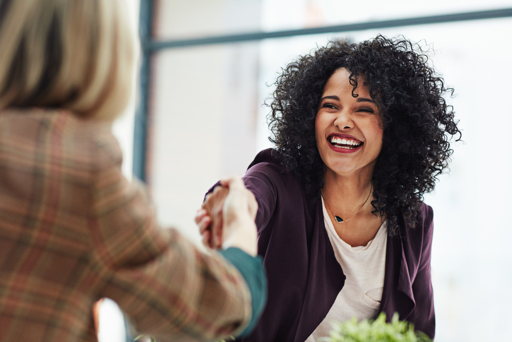 A person shaking hands with another person at work