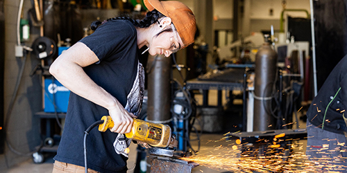 Student working on projects in a college welding class.