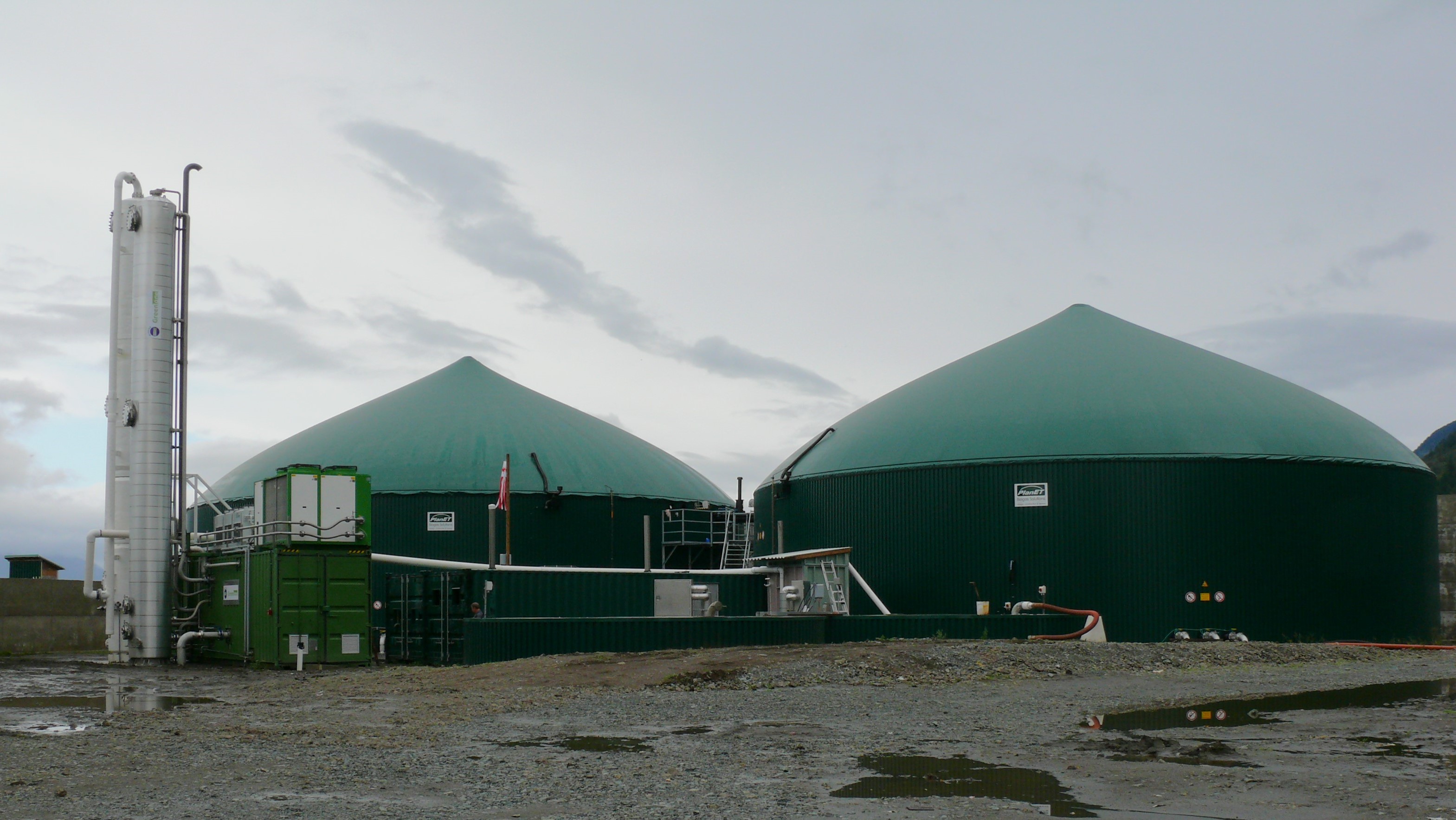 2 green-domed biogas structures standing beside each other