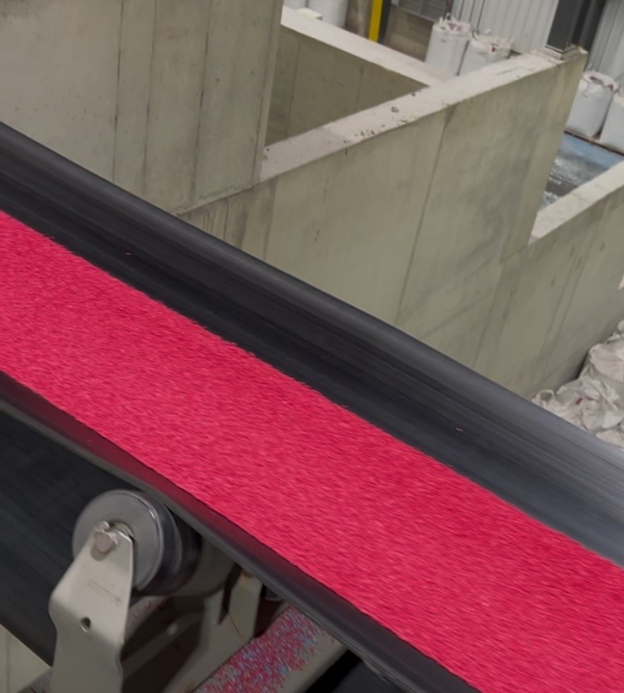 An image of the coated fertilizer product as it moves through processing plant