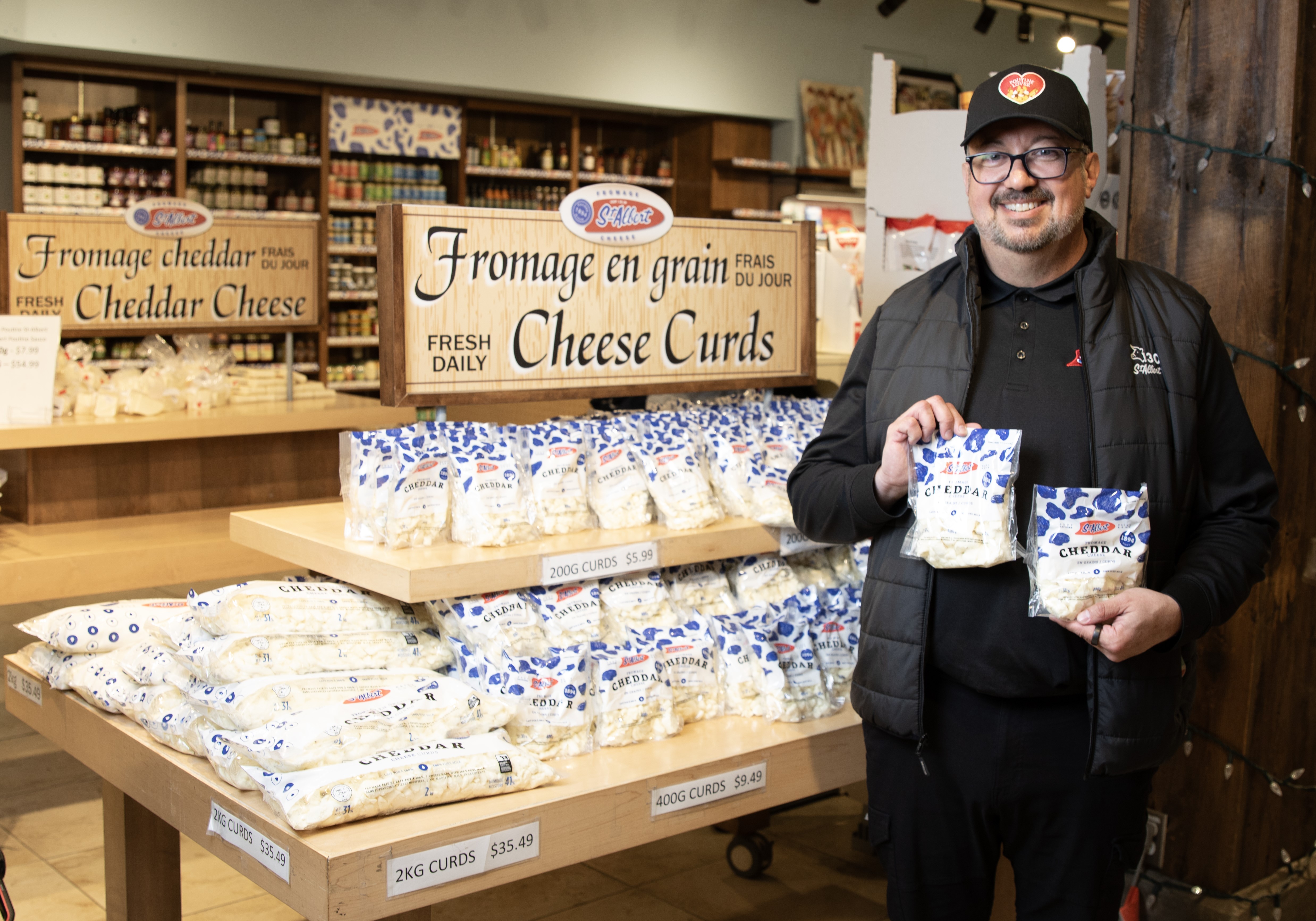 Éric Léveillé, business development director, St-Albert Cheese Co-operative holds packages of their products