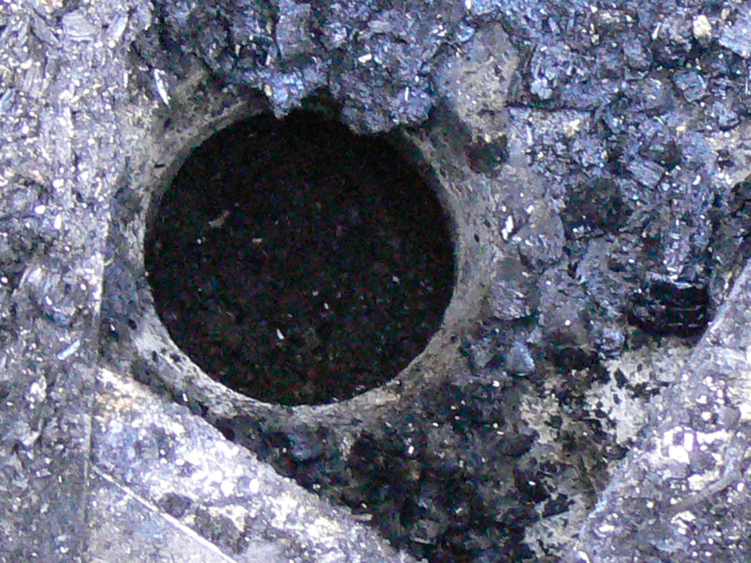 an open pull plug hole to a pit below, the probable source of methane in a barn fire