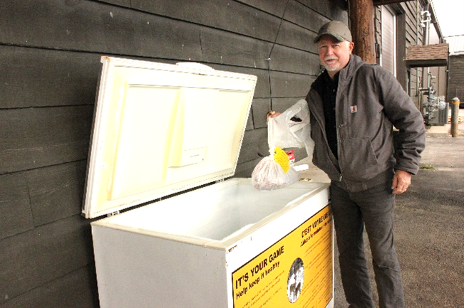 Hunter submitting a sample from harvested deer at a CWD depot. 