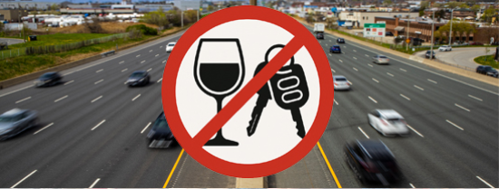 Photo of a highway with an icon of a crossed out wine glass and car keys in the foreground representing “no drinking and driving”