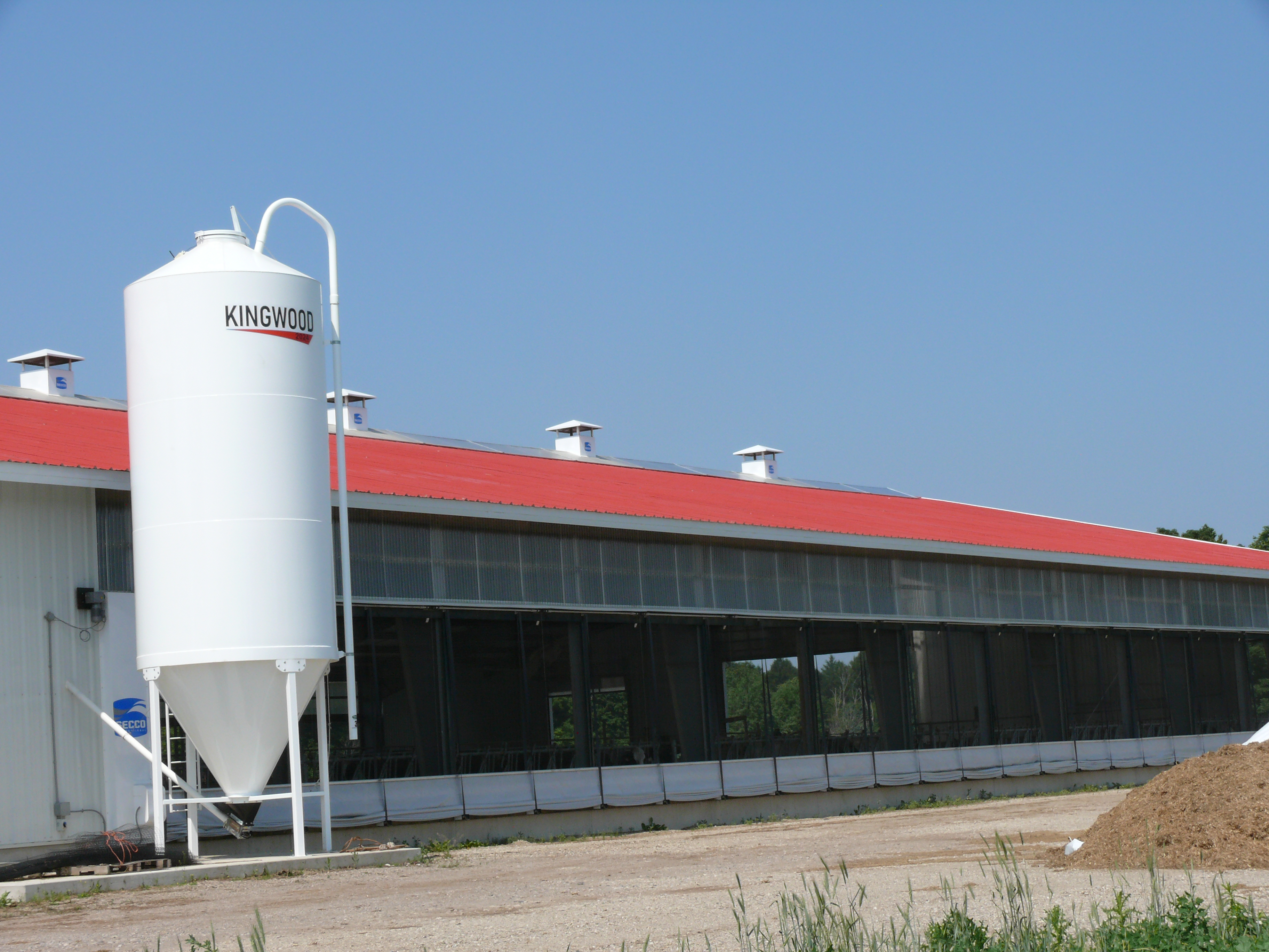 Figure 2 shows naturally ventilated dairy barn with side wall openings and the ridge openings (chimneys).