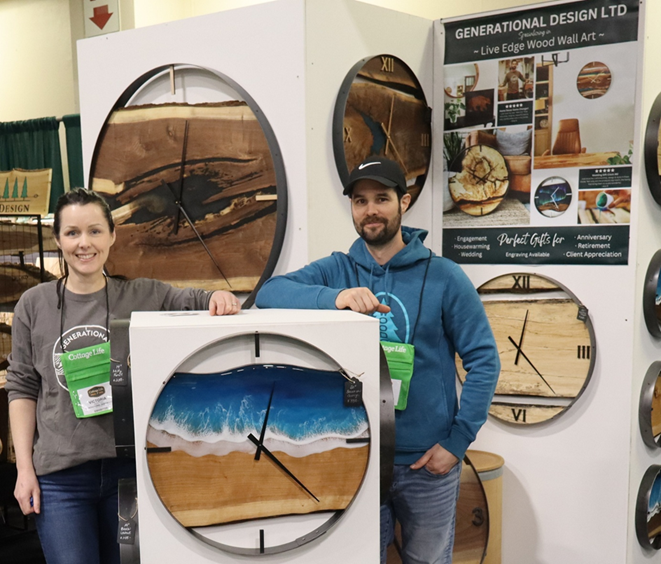 People standing next to a large round clock.