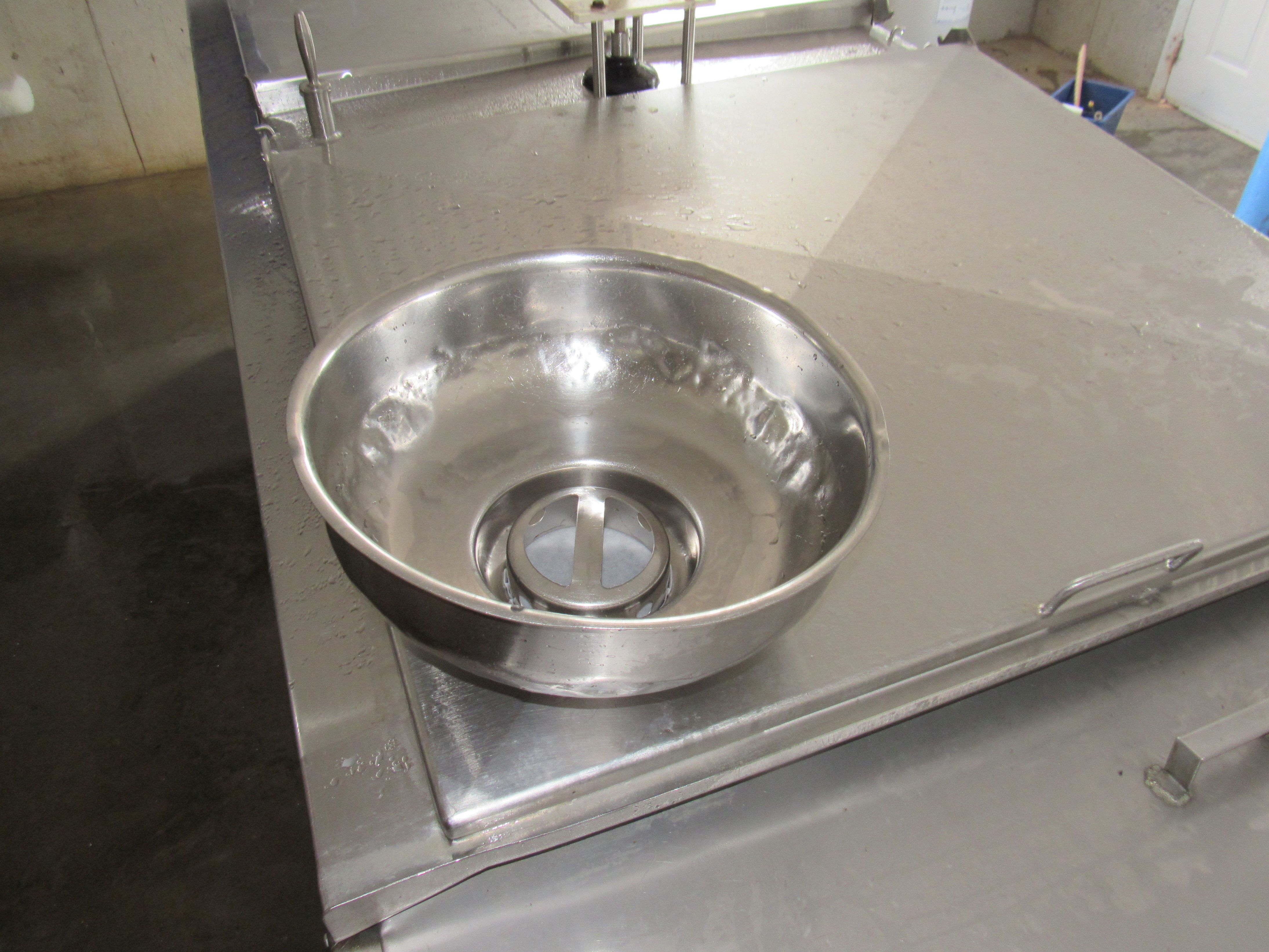 A milk strainer with a properly secured filter disc