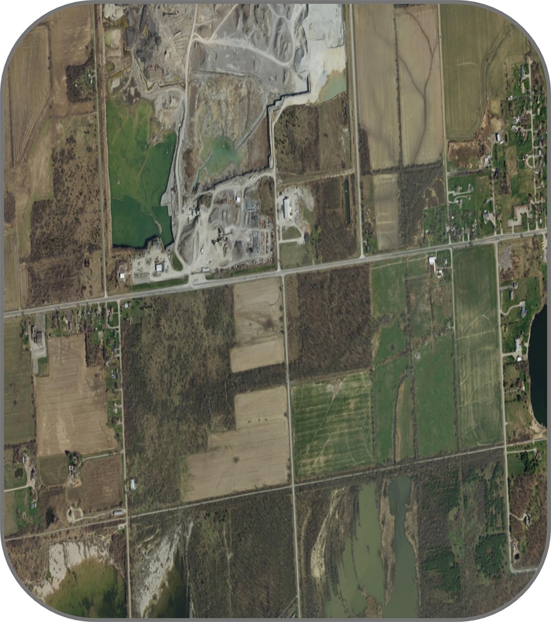 aerial photograph of rural lands, with a less uniform agricultural landscape